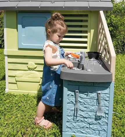 Smoby children's toy house for outdoor play, featuring colorful design, windows, and door, perfect for outdoor fun and imaginative play