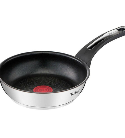 Stainless steel Tefal E3000104 frying pan with 18 cm diameter, suitable for house and kitchen cooking, shown from above.