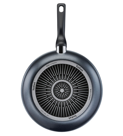 Tefal XL FORCE black aluminium frying pan with a 32 cm diameter, suitable for home cooking, showing a clean, non-stick surface.