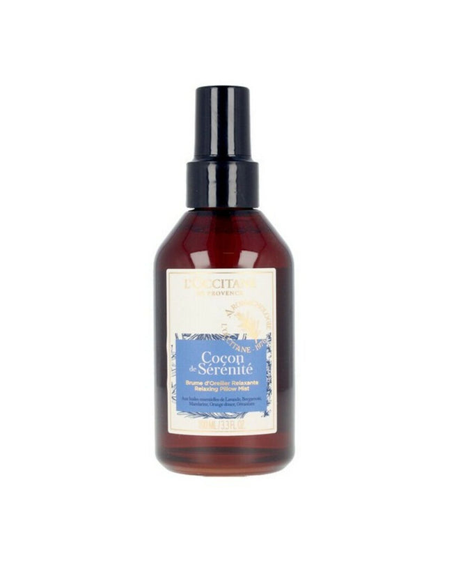 L'Occitane En Provence Cocondé Sérénité 100ml cushion mist with floral and calming design in a clear glass spray bottle.