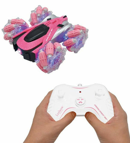 Pink and black Lexibook Crosslander RC police car toy with remote control, designed for children, in a playful outdoor setting.