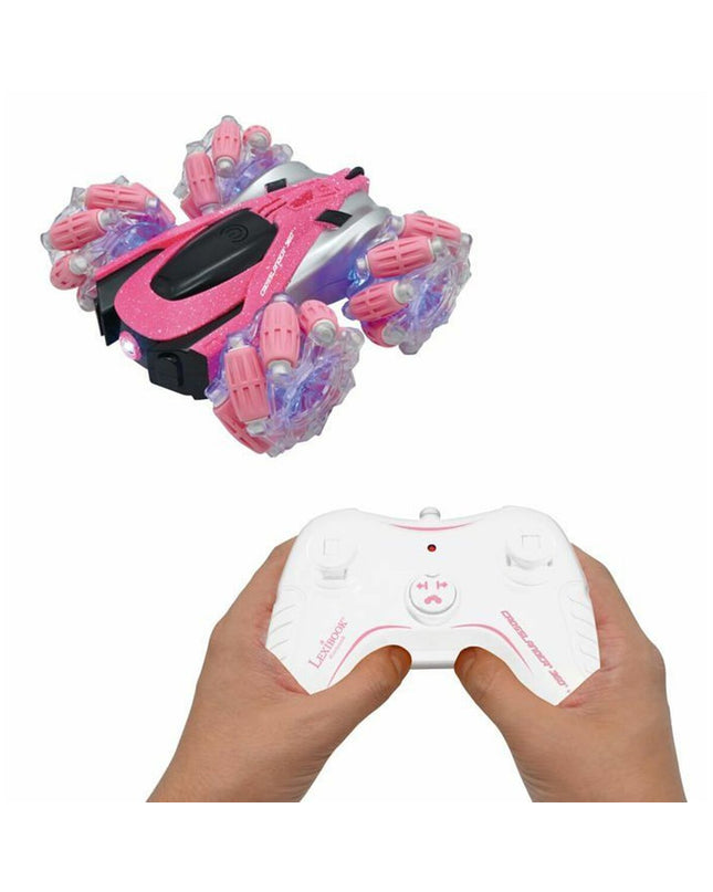 Pink and black Lexibook Crosslander RC police car toy with remote control, designed for children, in a playful outdoor setting.
