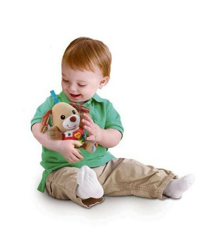 Soft Vtech Pequeperrito activity toy for babies, featuring colorful plush fabric and interactive elements for sensory play.