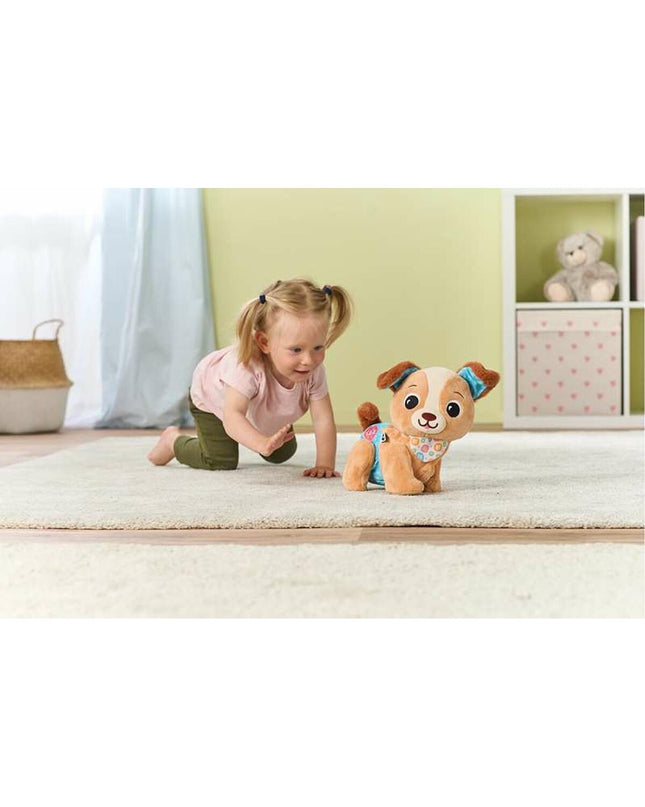 Vtech soft plush toy dog, cuddly textile stuffed animal for children, featuring a friendly dog design and colorful details.