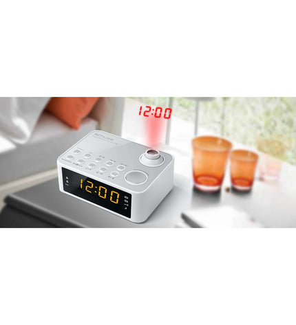 Muse M-178PW radio alarm clock with digital display and control buttons, placed on a bedside table.