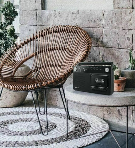 Black Muse M-152 RC portable radio with cassette player, vintage electronic audio device for music and radio listening.