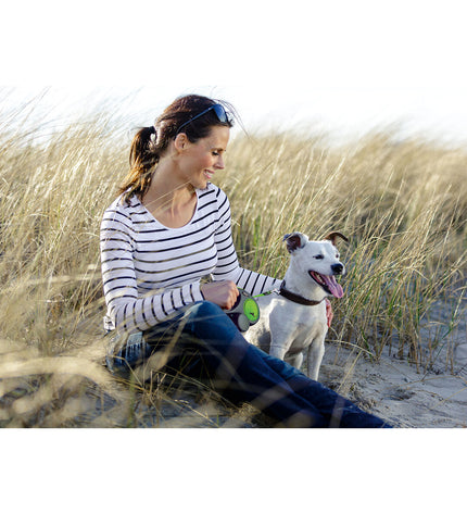 Pink Flexi 5-meter dog leash by Flexi, showing the retractable nylon leash with handle and locking mechanism for dogs.