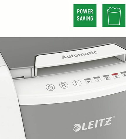 Leitz IQ 100 Autofeed paper shredder for office use, with visible paper feed slot and control panel, in a modern office setting.