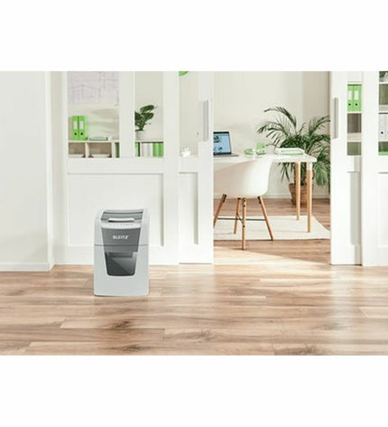 Leitz IQ 100 Autofeed paper shredder for office use, showing the compact black device with paper entry and control panel.