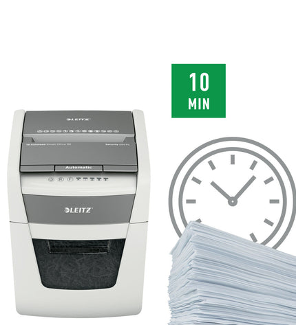 Leitz IQ Autofeed 50X P4 paper shredder for office use, showing the compact design and shredder slot in a modern office setting.