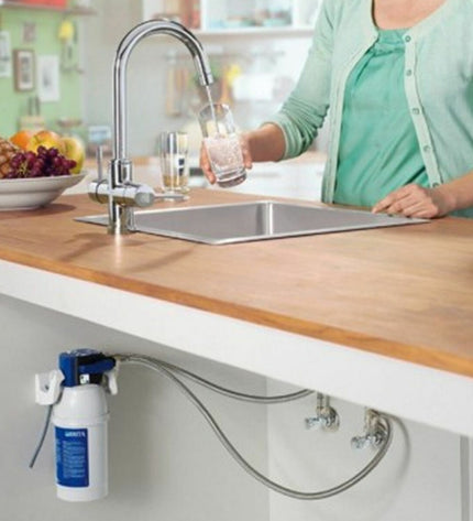 Brita faucet filter for kitchen use, plastic housing with filter cartridge, designed to improve tap water quality