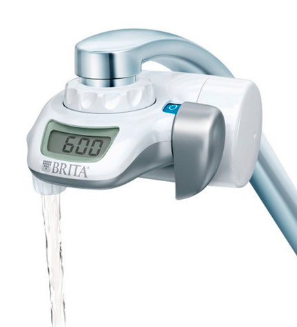 Brita On Tap faucet filter installed on kitchen tap, providing clean, filtered drinking water for home use.
