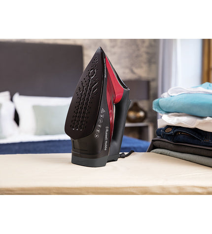 Remington steam iron for household use with ergonomic handle and stainless steel soleplate, ready for ironing clothes.