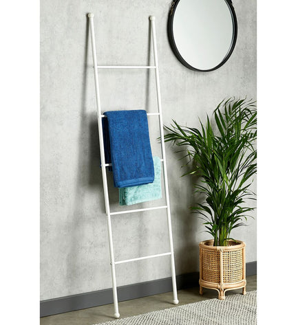 Wenko Viva Trap white towel rack for bathroom, with multiple bars for hanging towels, mounted on a bathroom wall.