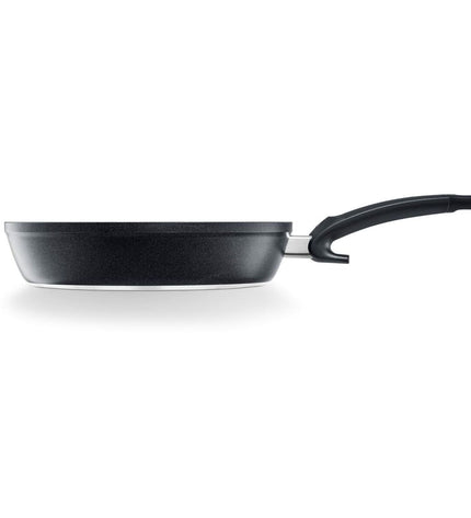 Fissler 15910520100/0 black aluminum 20cm frying pan for cooking and kitchen use, with sturdy handle and non-stick surface.