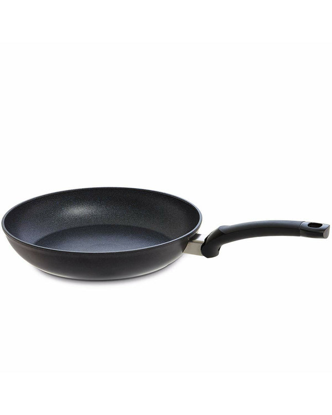 Black aluminium Fissler ADAMAT CLASSIC frying pan for home cooking, shown with a smooth non-stick surface and ergonomic handle.