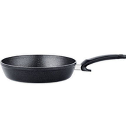 Fissler 28cm black aluminium frying pan for home cooking, shown with a non-stick surface and ergonomic handle.