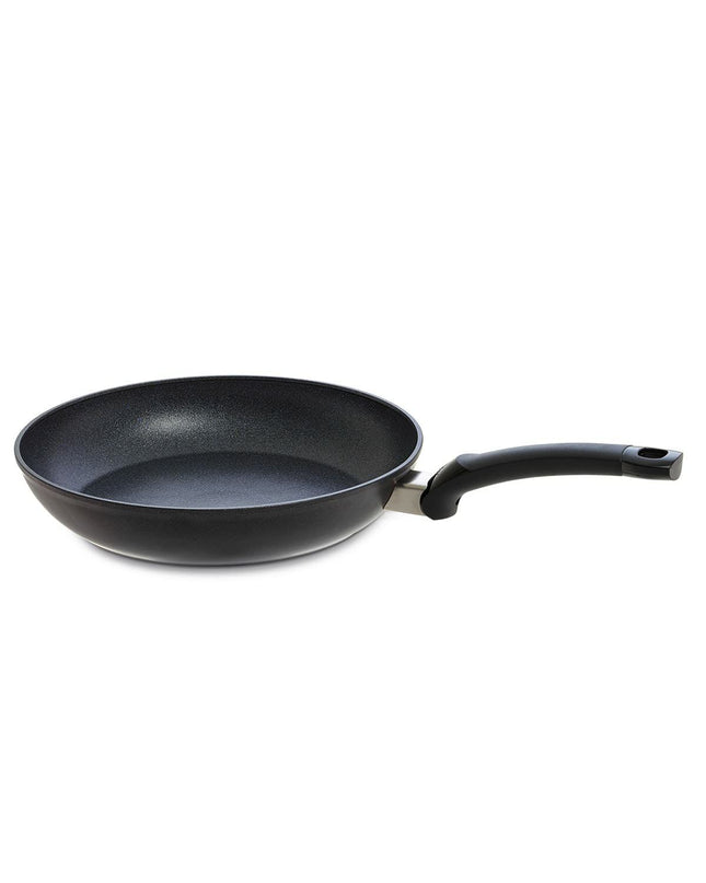 Fissler ADAMAT CLASSIC black aluminium cookware for home cooking, showing the sleek black pan with handle and lid on a kitchen surface.