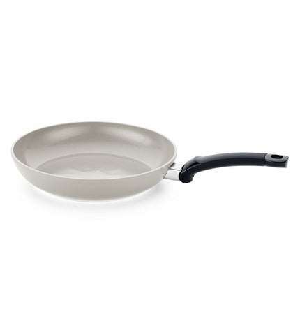 Fissler aluminium cookware pan for home cooking, showing a close-up of the sleek, durable metal surface and handle design.