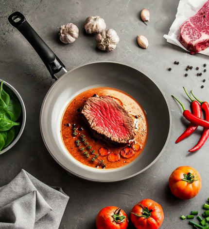 Fissler aluminum frying pan with gray finish, 28 cm diameter, suitable for home cooking and kitchen use.