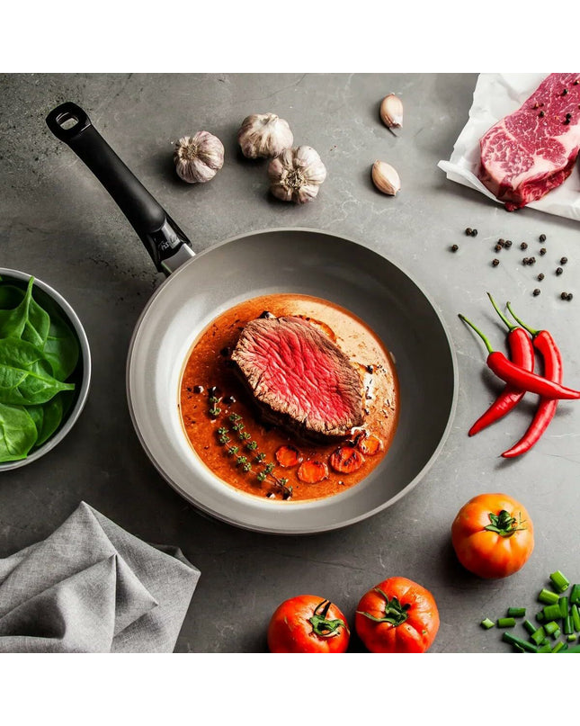 Fissler aluminum frying pan with gray finish, 28 cm diameter, suitable for home cooking and kitchen use.