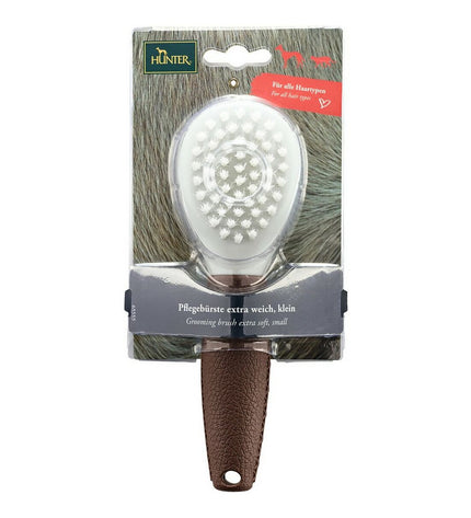 Hunter Extra Soft dog brush with ergonomic handle, designed for gentle grooming and detangling of furry coats.
