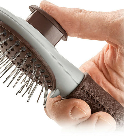 Hunter self-cleaning dog hairbrush with ergonomic handle, designed for grooming and removing loose fur from dogs.
