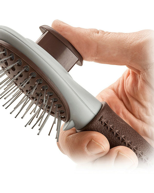 Hunter self-cleaning dog hairbrush with ergonomic handle, designed for grooming and removing loose fur from dogs.
