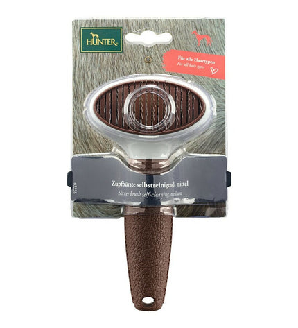 Hunter Zelfreinigend hondenborstel with ergonomic handle and metal bristles for easy grooming and shedding control.