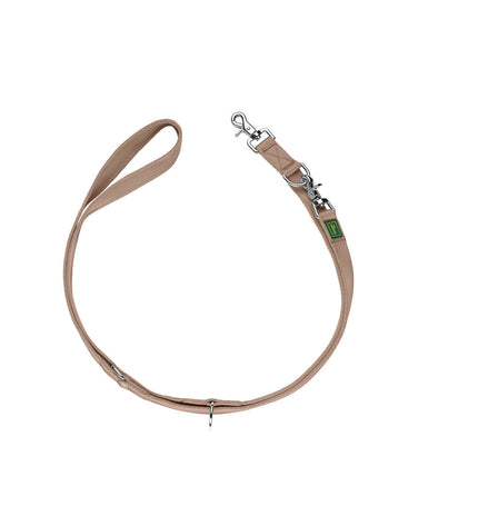 Hunter Inari beige dog leash, 200 cm long, with durable nylon and padded handle, shown in a natural outdoor setting.
