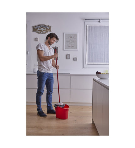 Vileda white microfiber floor mop for household cleaning, ideal for easy and effective floor scrubbing.