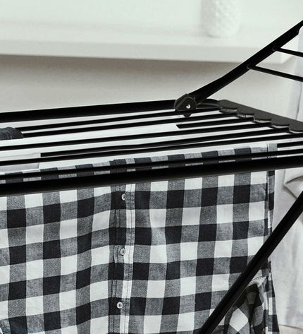 Vileda Extra Black foldable clothes drying rack in black with multiple horizontal bars for hanging laundry.