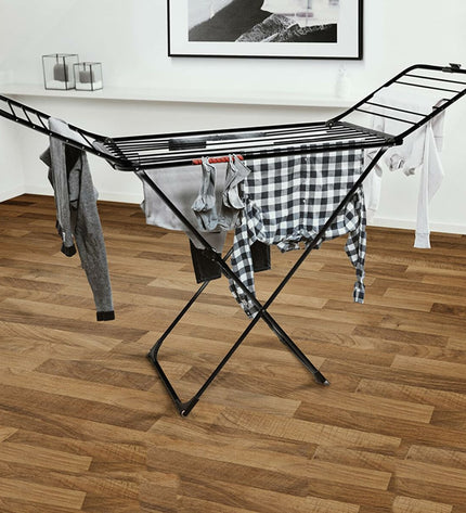 Vileda extra black foldable laundry drying rack with multiple bars for clothes drying, measuring 174 x 56 x 116 cm.