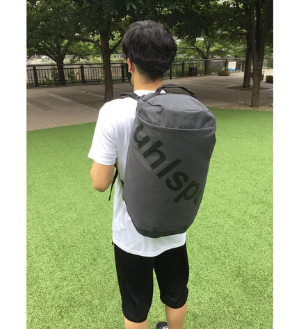 Uhlsport sports bag 100426102 in black with logo, ideal for outdoor and sports fan activities, showing durable fabric and handles.