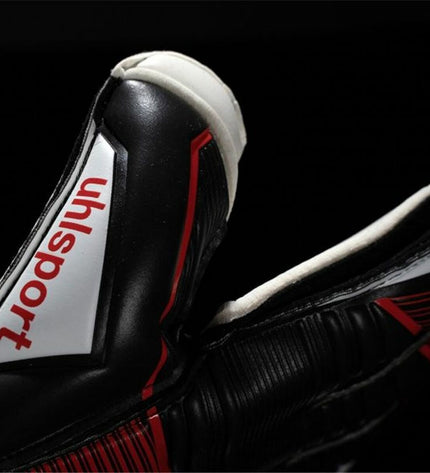 Black Uhlsport Powerline Soft Flex goalkeeper gloves for adults, designed for football and outdoor sports.