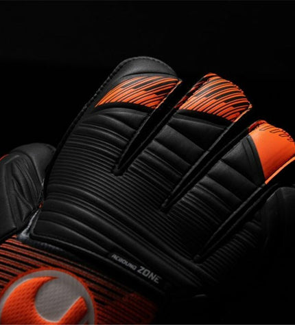 Orange Uhlsport Keeperhandschoenen Soft Ressist+ for adults, designed for soccer goalkeeping with padded palms and durable construction.
