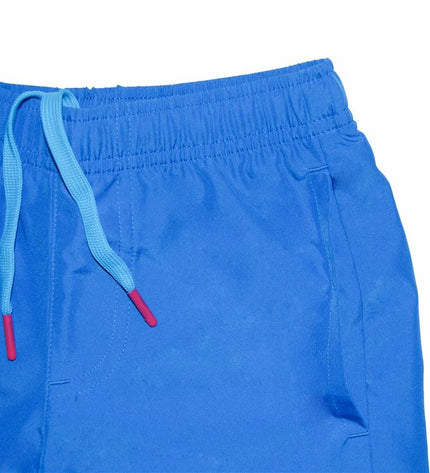 Blue Puma men's swim trunks, sporty watersport shorts with Puma logo, suitable for outdoor and water activities.