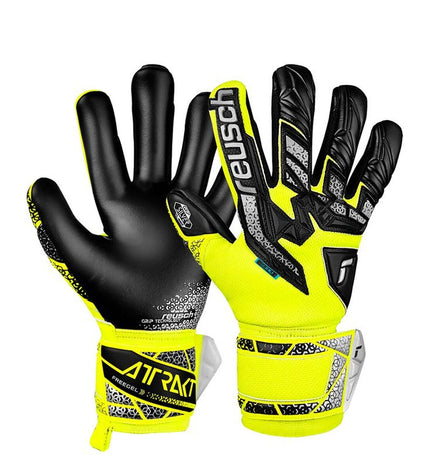 Reusch Attrakt Freegel yellow adult goalkeeper gloves for soccer, featuring padded fingers and secure wrist strap.