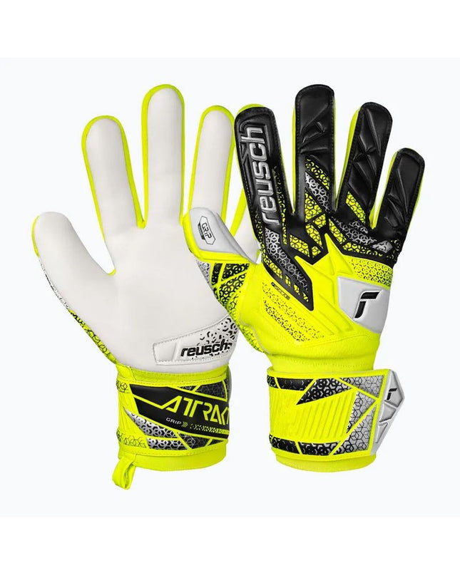 Reusch Attrakt Grip safe yellow goalkeeper gloves for adults, designed for soccer and outdoor sports, with textured palm for grip.