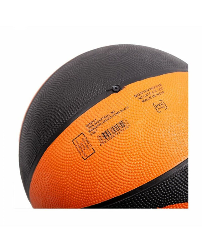 Puma indoor basketball in black and orange with textured surface and official size 7 for sports and outdoor play.