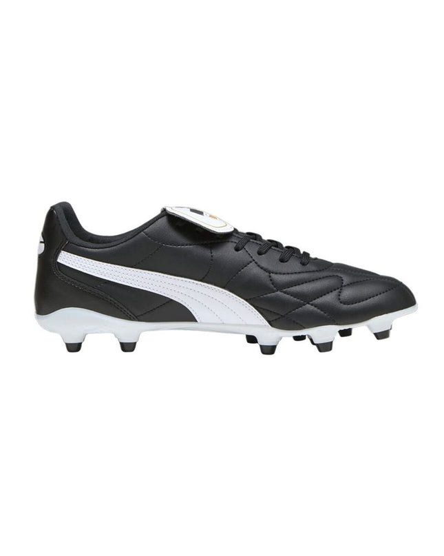 Adult Puma King Top FG/AG soccer cleats for outdoor and indoor football, featuring black and white design with Puma branding.