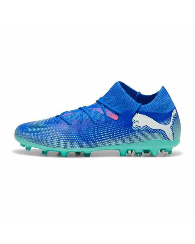 Adult Puma Future 7 Match Mg soccer cleats with black and white design, suitable for outdoor football matches.