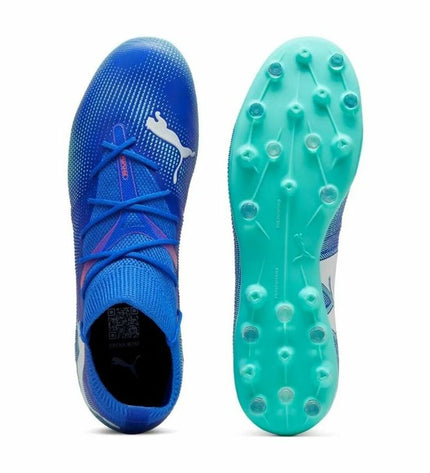 Adult Puma Future 7 Match Mg soccer cleats for outdoor football, showing black and white design with studded outsole.