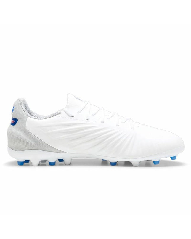 Adult Puma King Match MG football shoes in white, designed for outdoor soccer with a durable and stylish sport design.