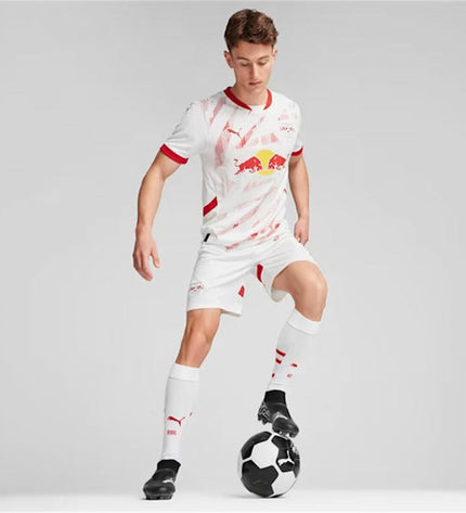 Puma RB Leipzig men's short-sleeve football T-shirt in sports and outdoor category, featuring team logo and red and white design.