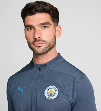 Adult Puma Manchester City 24/25 training sweatshirt for soccer, featuring team logo and sporty design, perfect for training sessions.