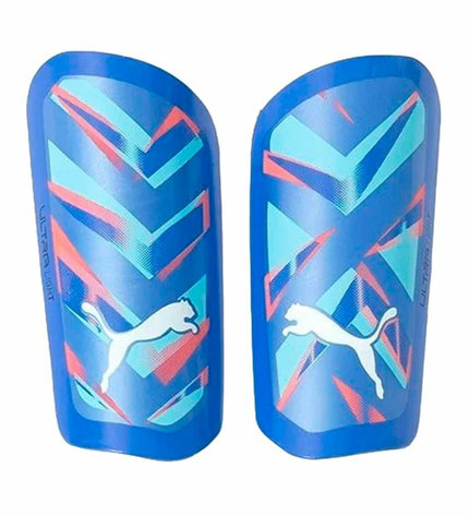 Blue Puma Ultra Light Soccer Shin Guards with sleeve, designed for comfortable protection during football matches.