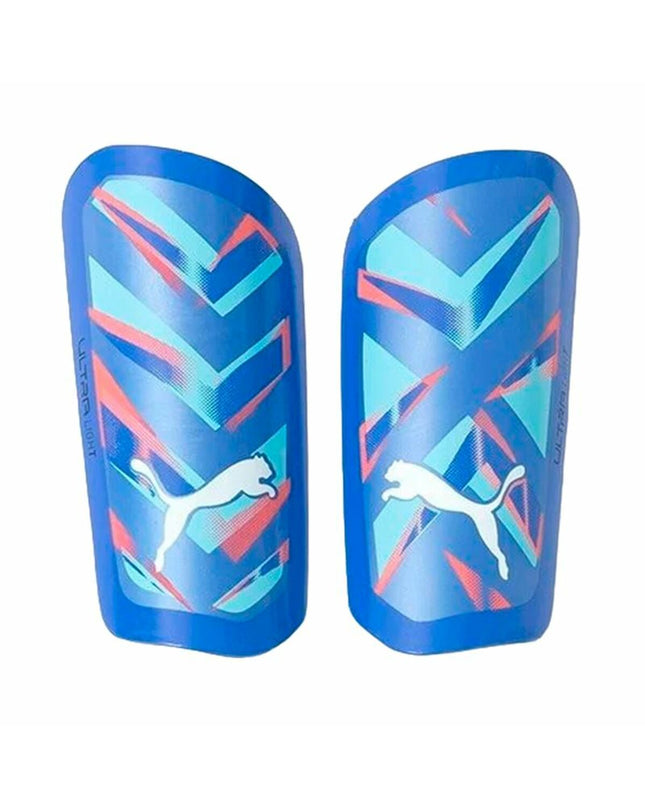 Blue Puma Ultra Light Soccer Shin Guards with sleeve, designed for comfortable protection during football matches.