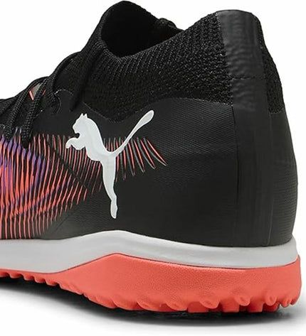 Adult Puma Future 8 Match TT soccer cleats for outdoor football, featuring black and white design and studded outsole.