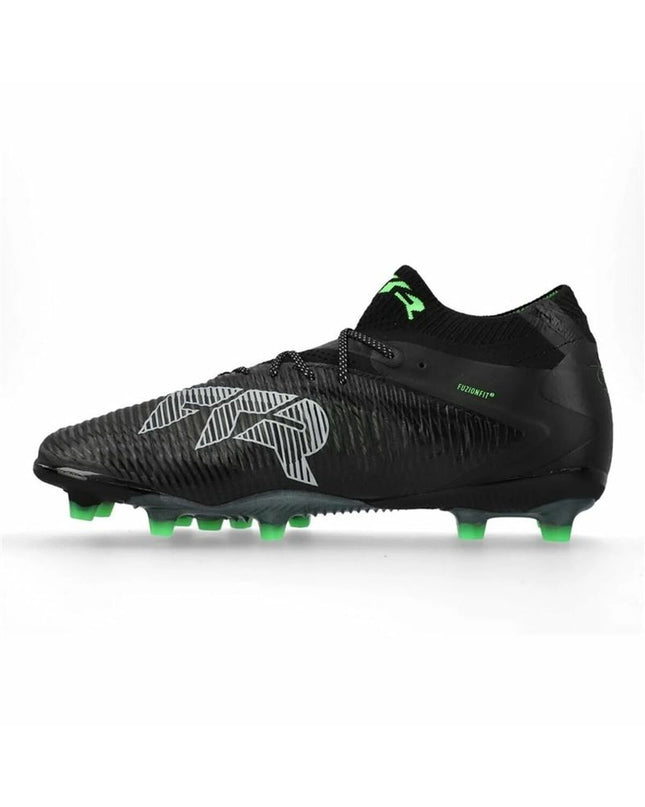 Adult Puma Future 8 Ultimate AG football cleats with black and white design and studded outsole for outdoor soccer play.